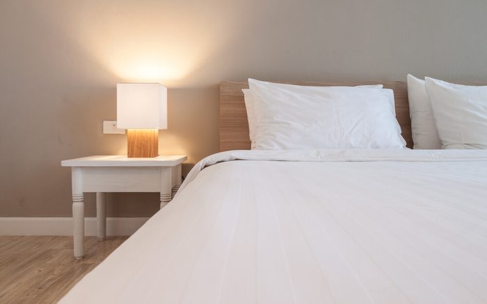 Bedroom with lamp, grey background