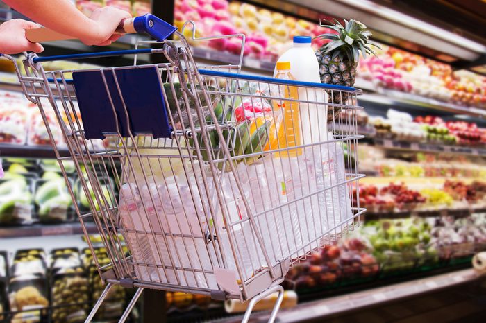 woman shopping cart in supermarket