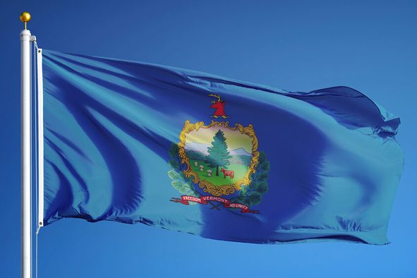Vermont (U.S. state) flag waving against clear blue sky, close up, isolated with clipping path mask alpha channel transparency, perfect for film, news, composition