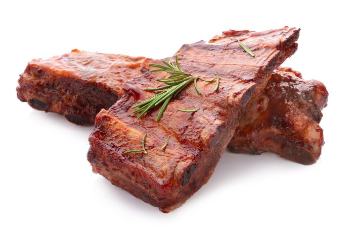 Delicious grilled ribs on white background