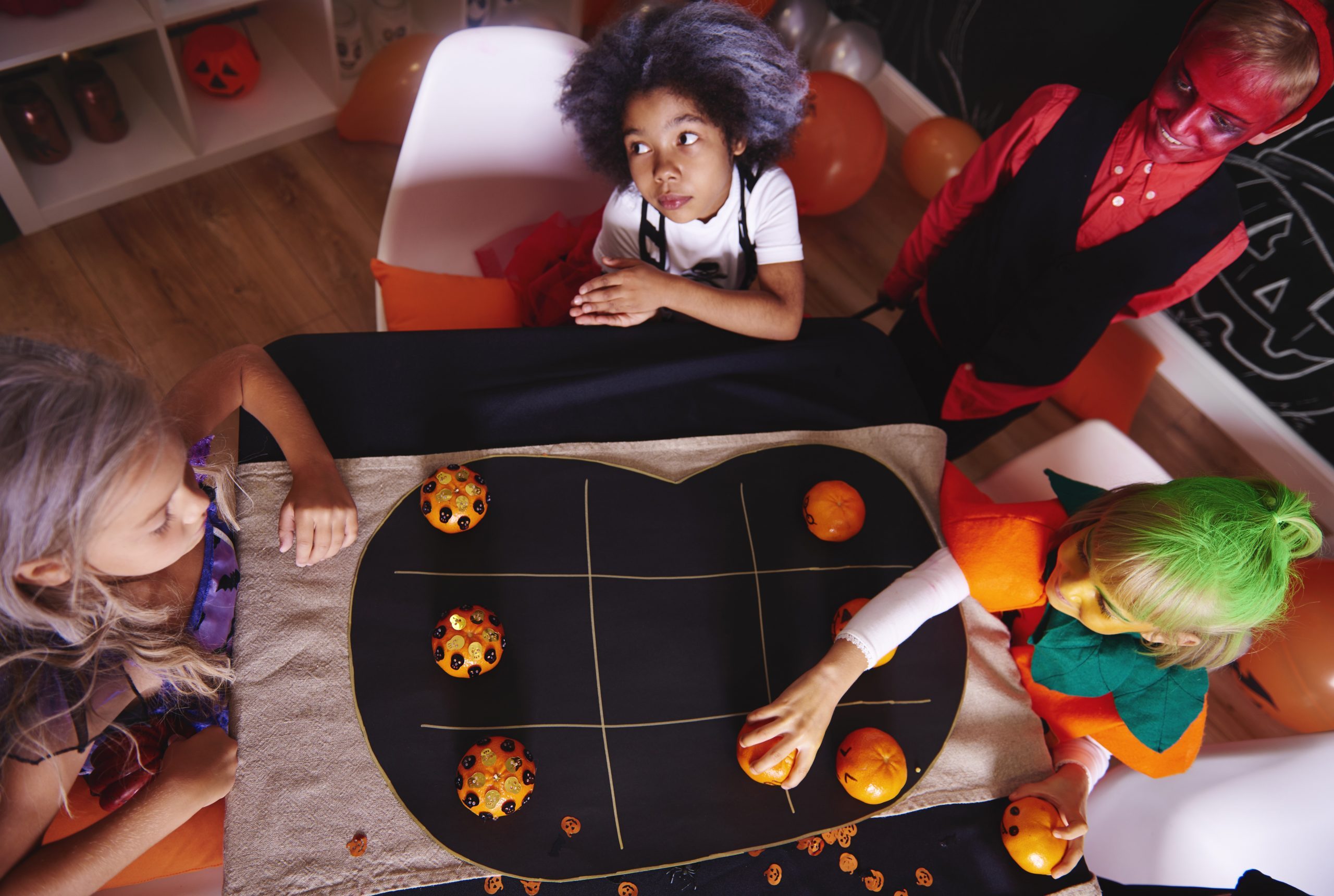 Kids playing halloween tic tac toe