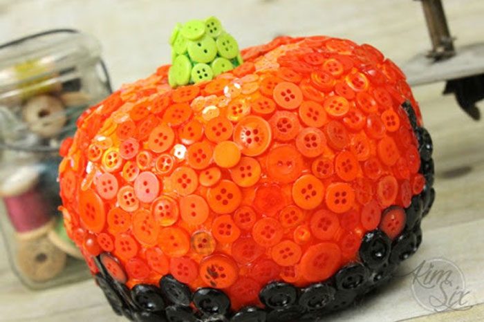 pumpkin decorated by being completely covered by buttons