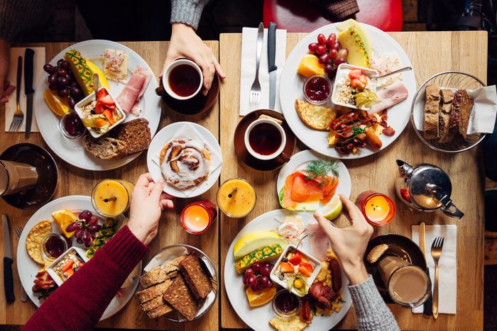 group of friends having christmas brunch in winter