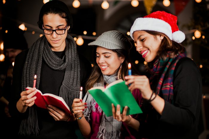 group of people singing christmas carols