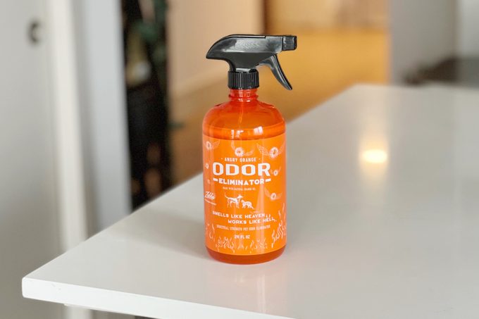 Orange spray bottle labeled 