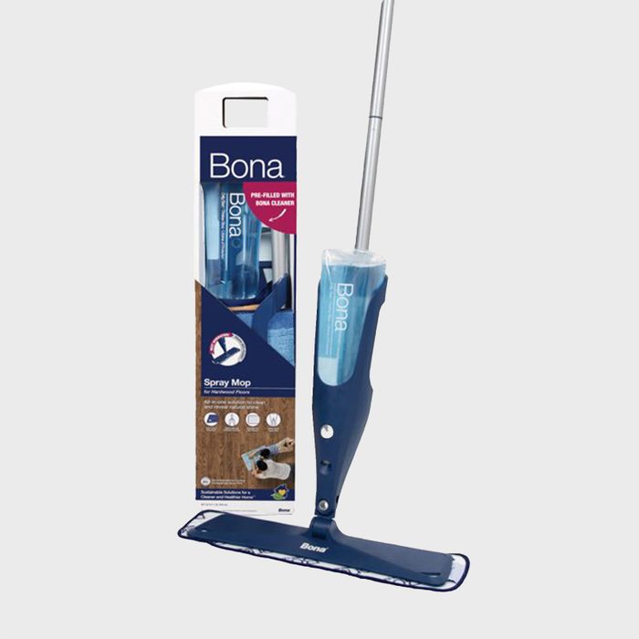 Spray mop stands beside packaging, featuring a blue design, marked 