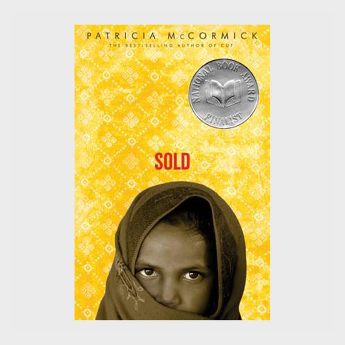 A girl's face is partially wrapped in a shawl against a yellow patterned background, with text 