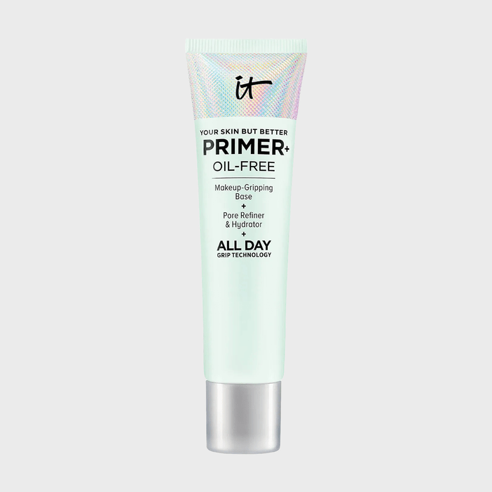 Primer tube stands upright, featuring makeup-gripping base and pore refiner benefits, labeled 