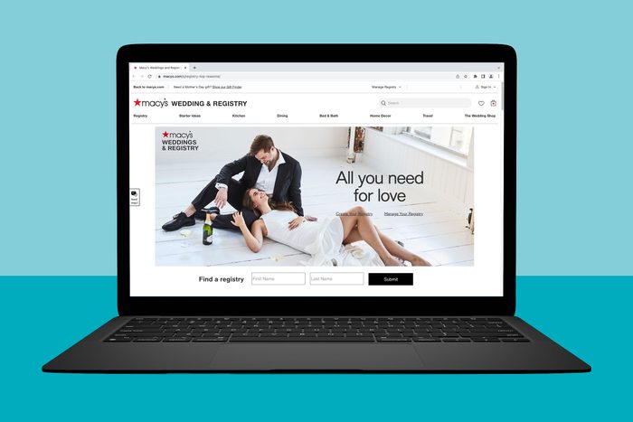 Laptop displays a Macy's wedding registry webpage featuring a happy couple lying on the floor. Text: 
