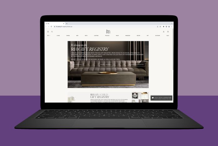 Laptop displaying RH Gift Registry website; features furnishings including a sofa and coffee table; set against a purple background.