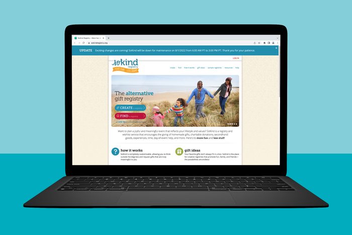 A laptop displays a website featuring an alternative gift registry. It shows a family walking on a beach and options to create or find a registry.