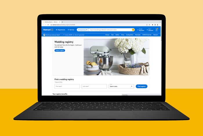 Laptop displays a wedding registry webpage, featuring kitchen items and flowers, set against a yellow background.