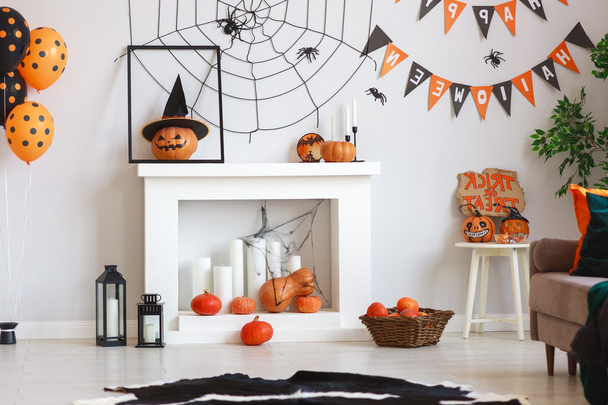 interior of house decorated for Halloween pumpkins, webs and spiders