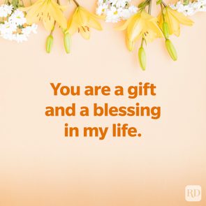 Yellow lilies hang above text saying, 
