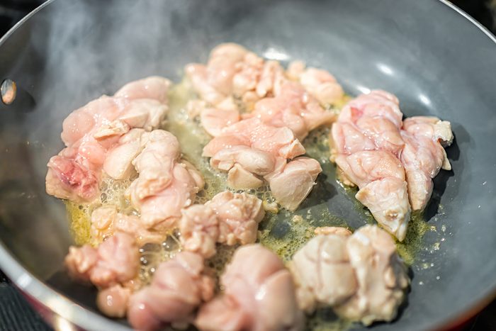 Macro closeup of fresh whole beef sweetbreads thymus organ gland, nutritious ancestral meat homemade food cooking frying on pan with steam