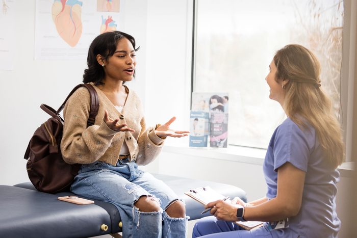 chatty girl asking doctor about other patients