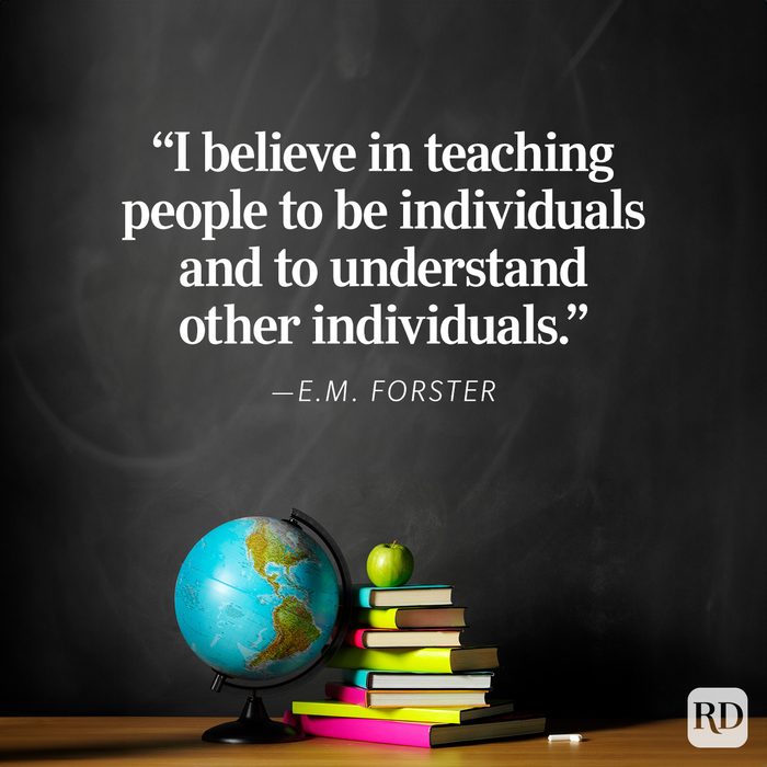 A globe sits next to stacked books with an apple on top, against a chalkboard displaying an E.M. Forster quote about individuality.