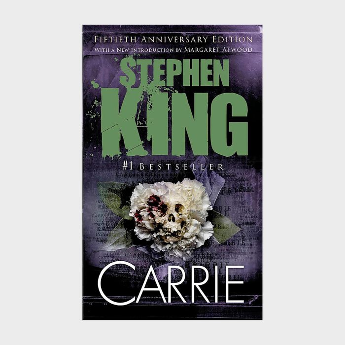 Book cover with a skull in flowers, reads 