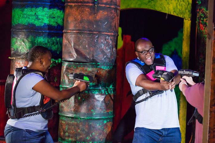 110 Romantic And Fun Date Ideas To Spark A Connection - couples playing laser tag